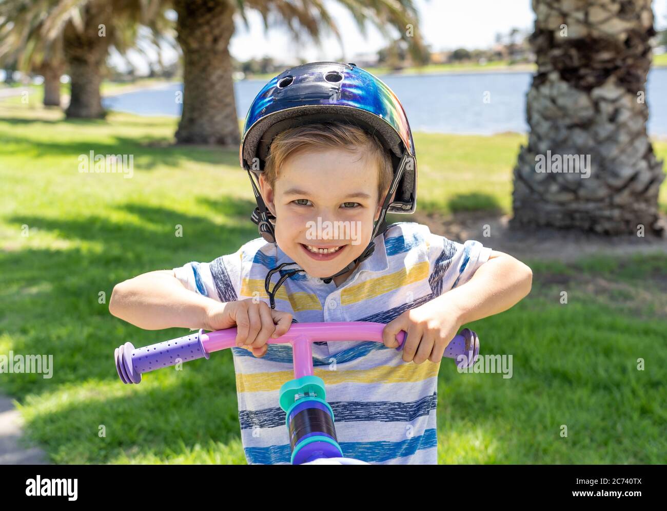 Happy Little Boy Riding a Bike Stock Image - Image of lifestyle