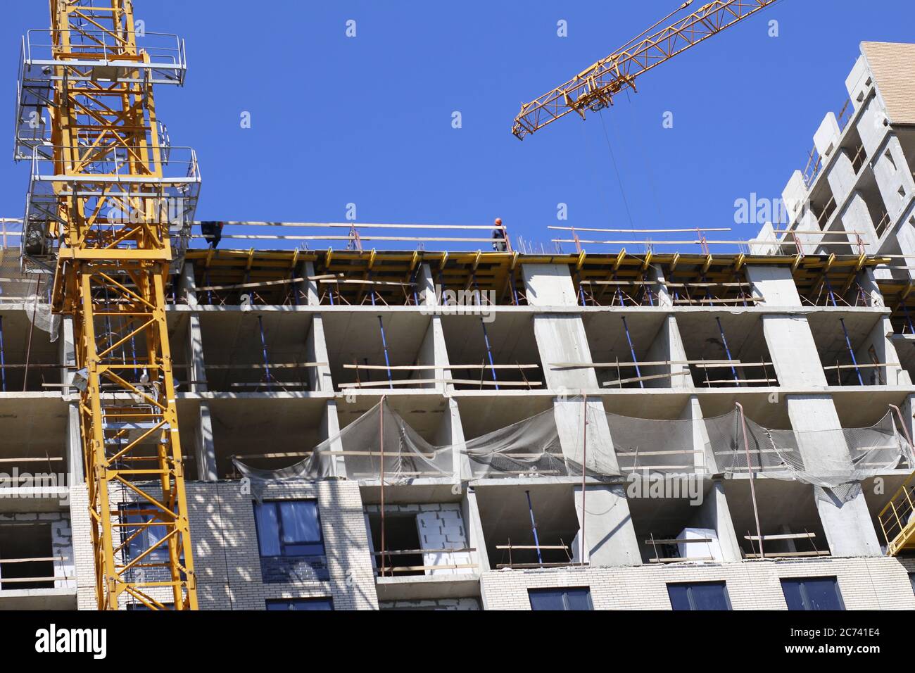 The construction of a new multi-storey building. Construction of a new frame energy-efficient home. Facade of a modern apartment. New buildings. Stock Photo