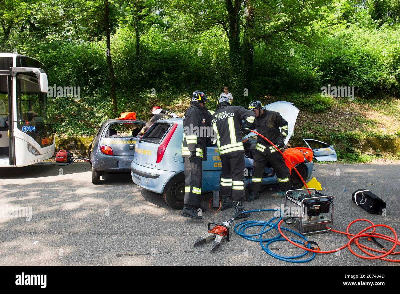 Europe, Italy, Lombardy, Monza. Emerlab Civil Defense Tutorial, Accident Simulation and Use of Equipment. Specifically, the sheet spreader and the hydraulic cutting-off machine to cut car parts and extract the injured person. Stock Photo