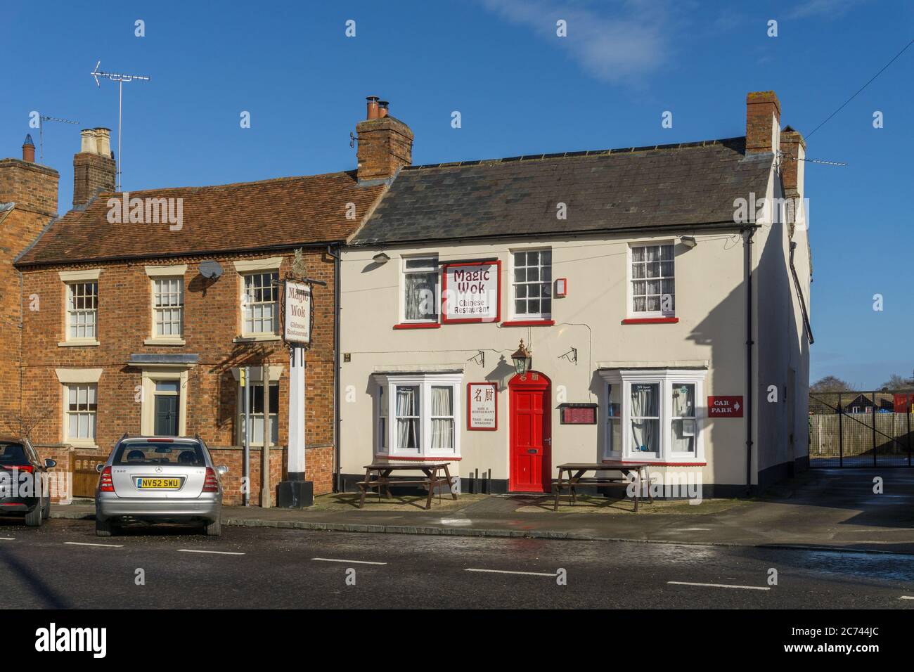 The Magic Wok, a popular Chinese Restaurant and Takeaway, situated in a former pub building, Newport Pagnell, Buckinghamshire, UK Stock Photo