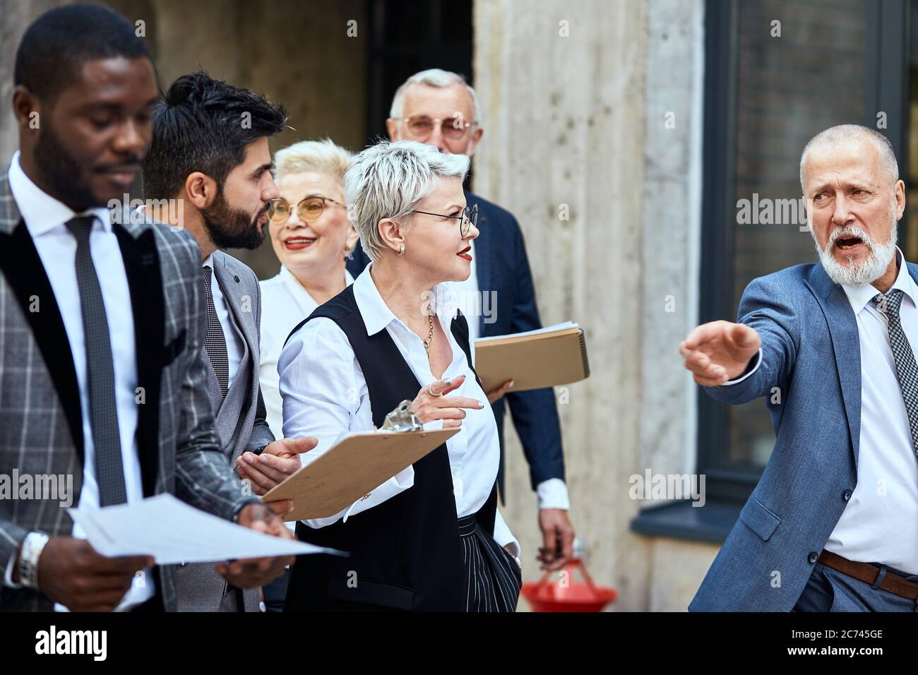 Group of businessmen wear stylish suits move outdoor Stock Photo - Alamy