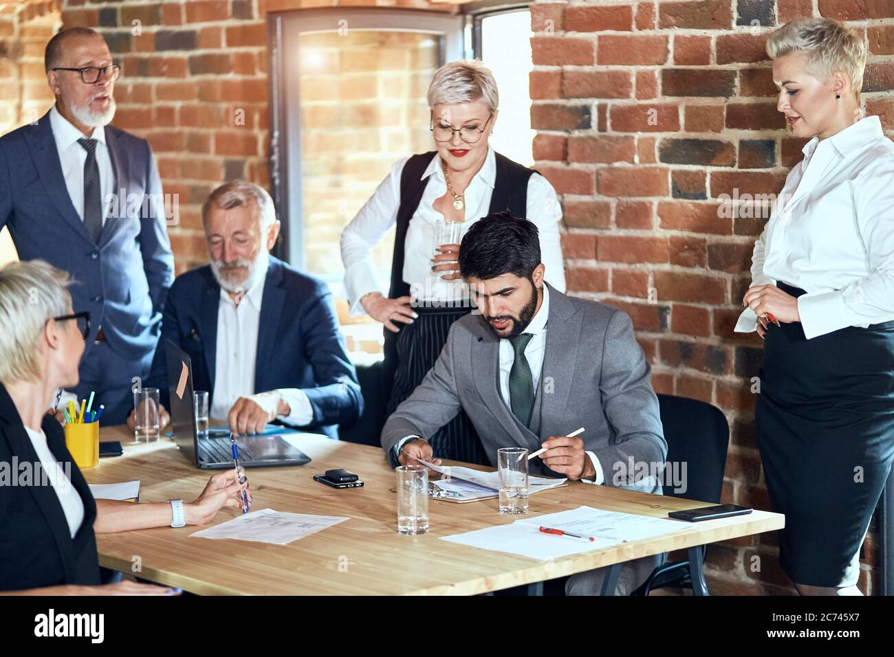 Group of six caucasian businessmen wear stylish office clothes in ...