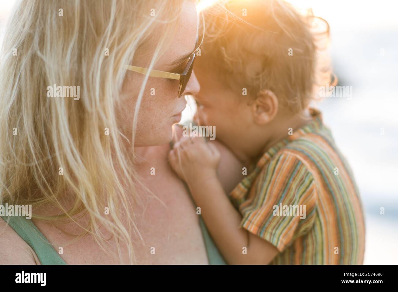 A mother and her child at sunset Stock Photo