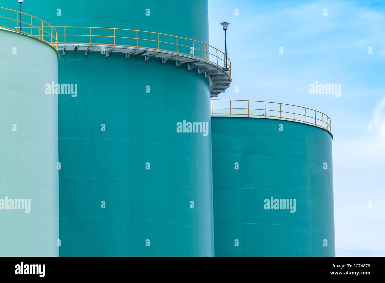 Closeup fuel storage tank in petroleum refinery. Blue big tank of oil