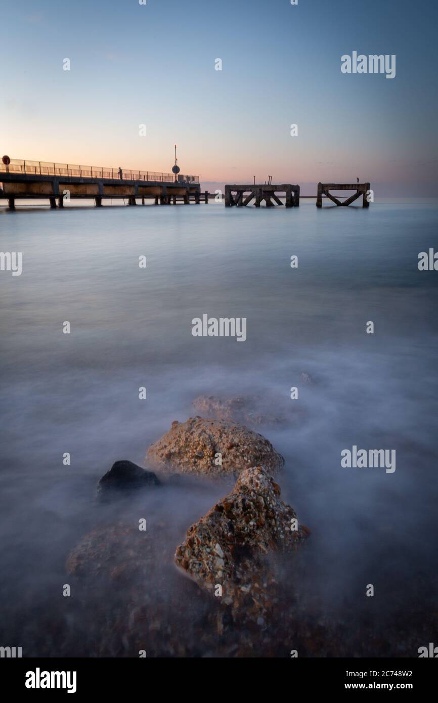 Sunrise over ocean and rocks hi-res stock photography and images - Alamy