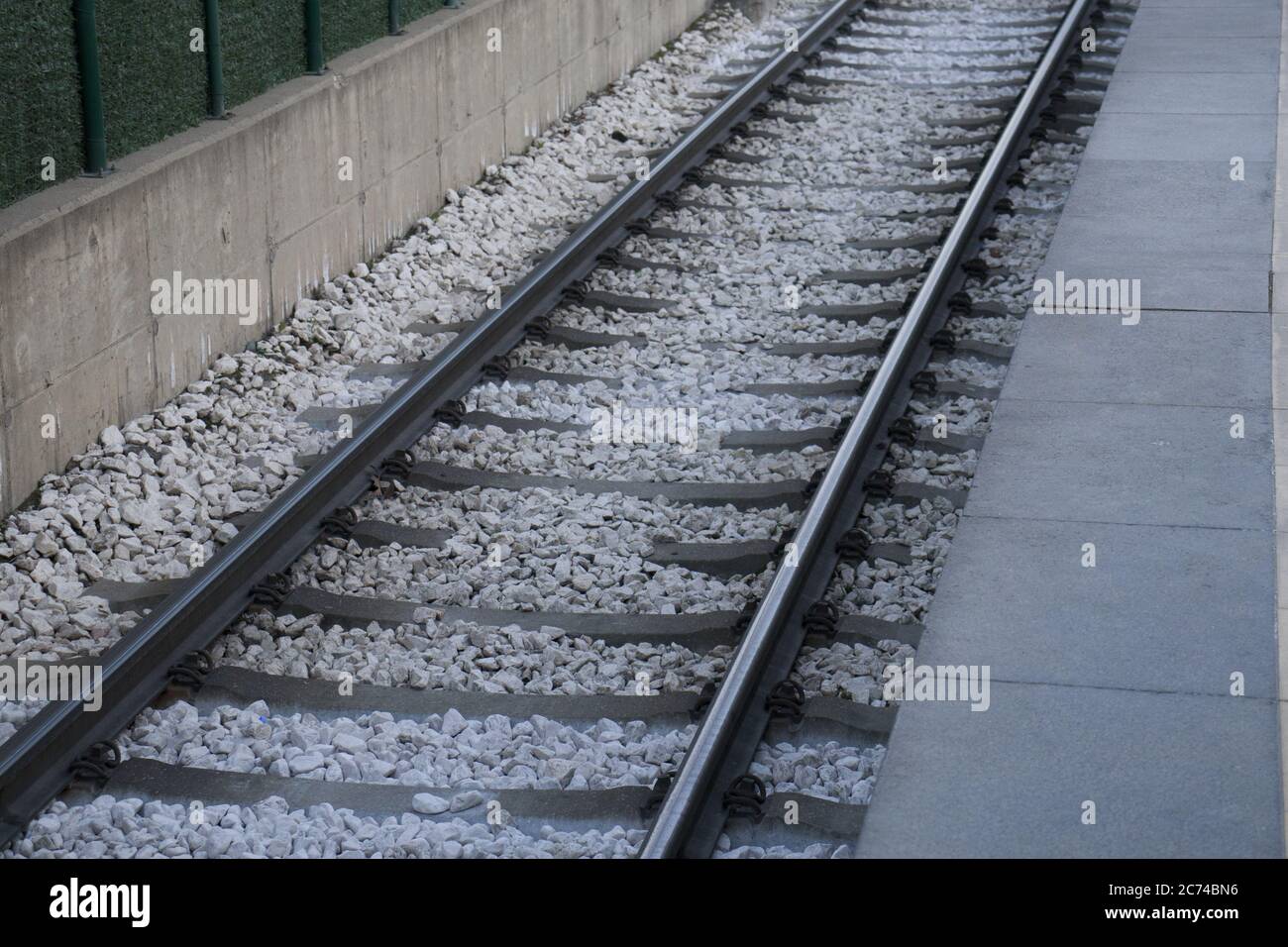Simple railway top view background. Train track texture. Steel rail on