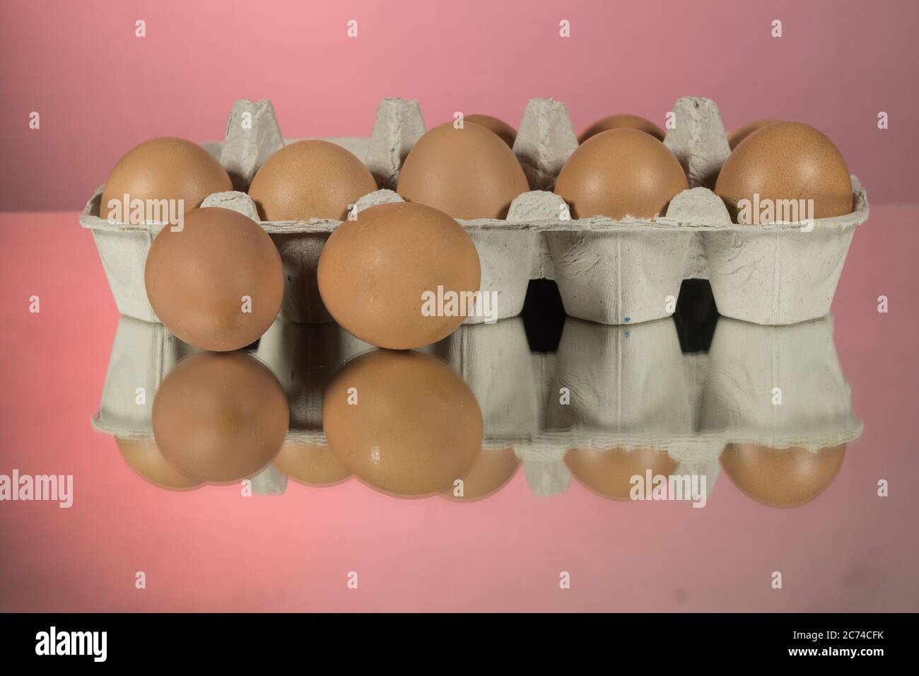 Closeup Eggs with the blue refrigerator 's tray on black mirror background Stock Photo