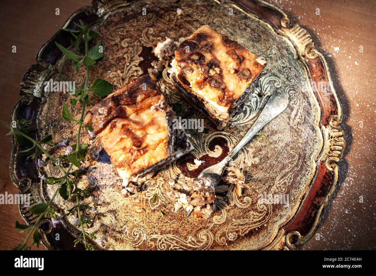 Typical Slovenian dessert with cream poppy seeds, in the studio on an elegant wooden tray. Stock Photo