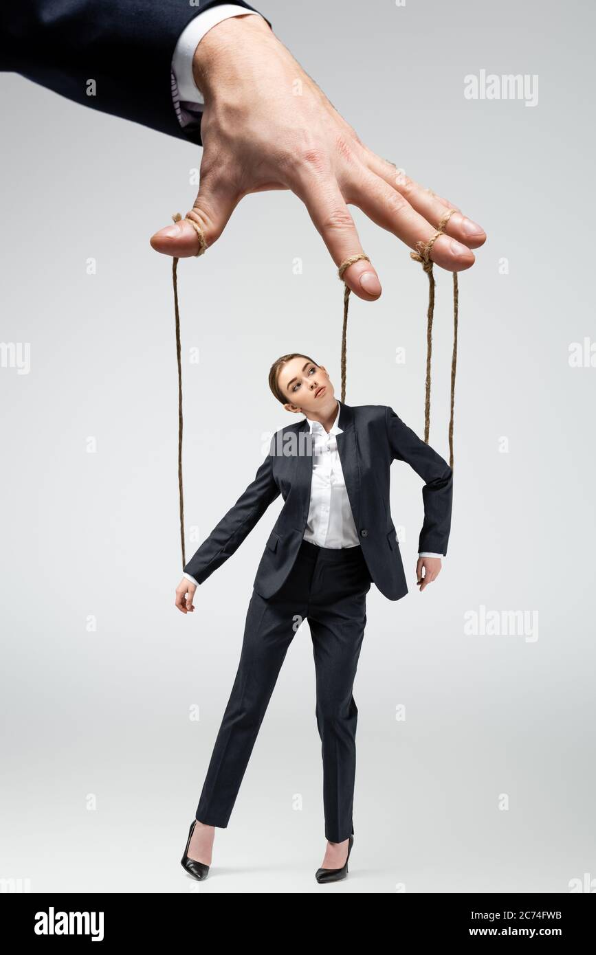 Puppeteer Holds The Puppet Business Man On The Ropes Stock Photo, Picture  and Royalty Free Image. Image 28107184.