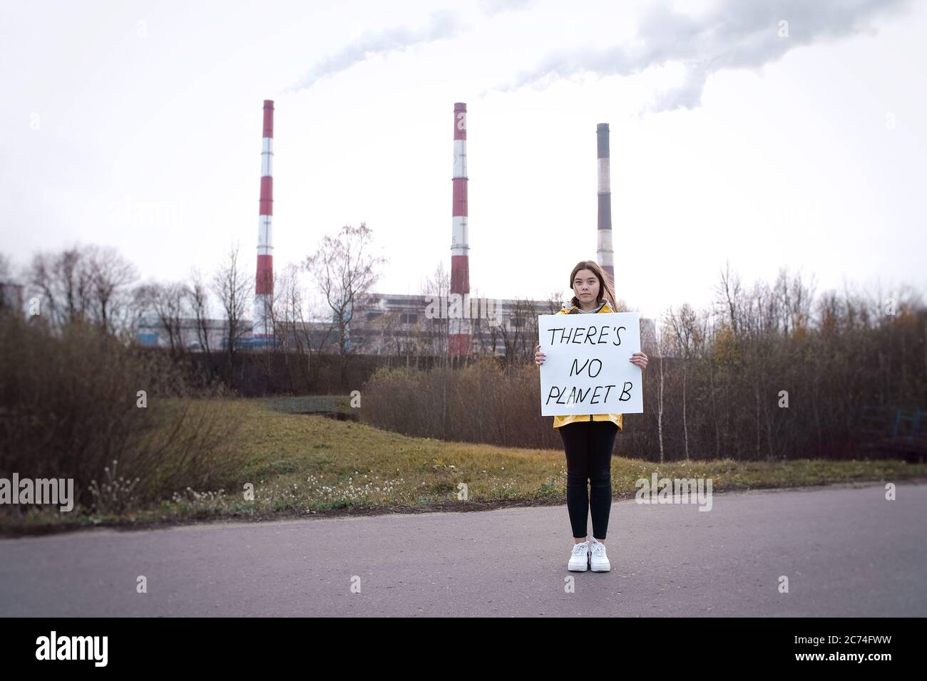 Teenager girl holding placard hi-res stock photography and images - Alamy