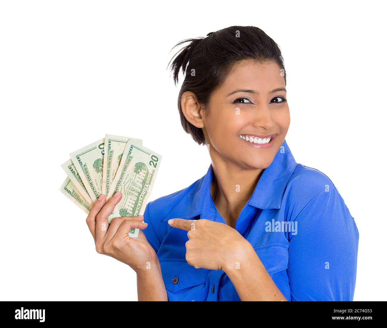 Portrait of a super happy successful woman holding money dollar bills in hand isolated on white background. Stock Photo