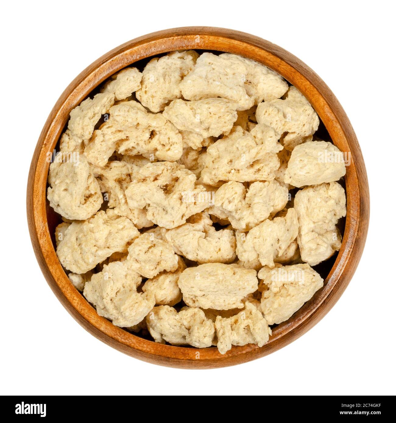 Soya chunks in wooden bowl. Textured soy protein, also known as soy meat. Defatted soy flour product, used as meat analogue or meat extender. Stock Photo