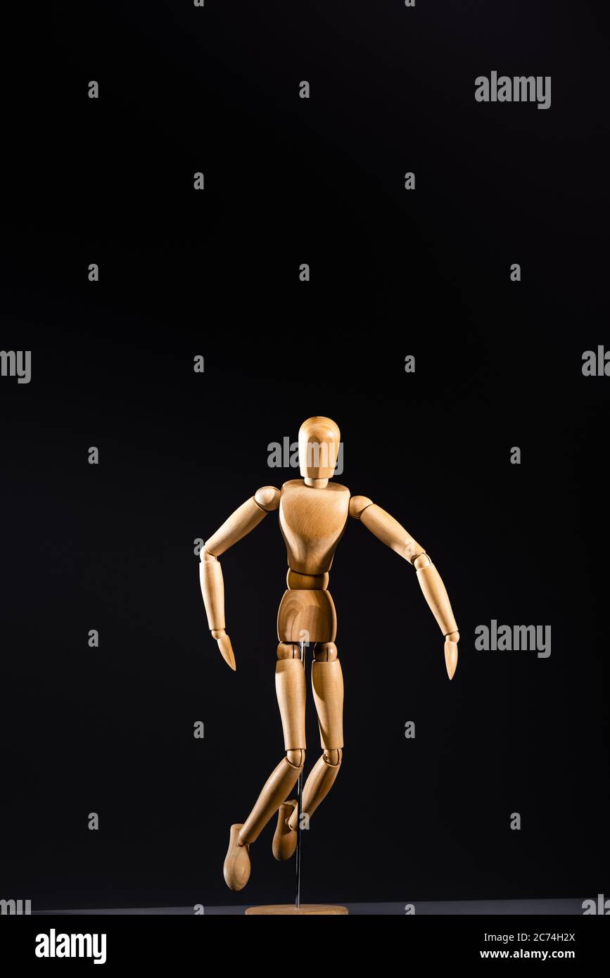 wooden posing isolated on black Stock Photo Alamy