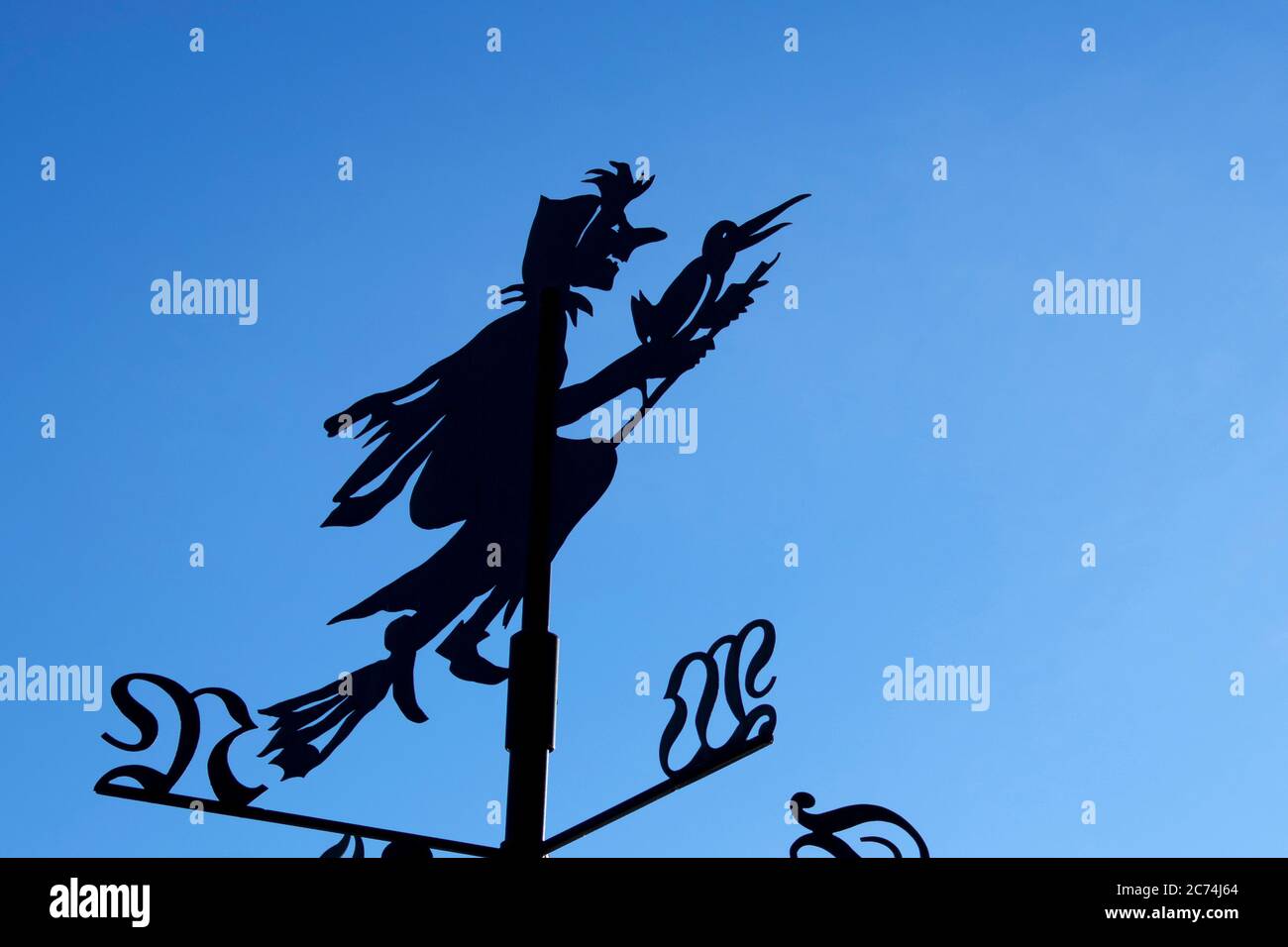witch riding on a broom, wind direction indicator, Germany, Hesse Stock Photo