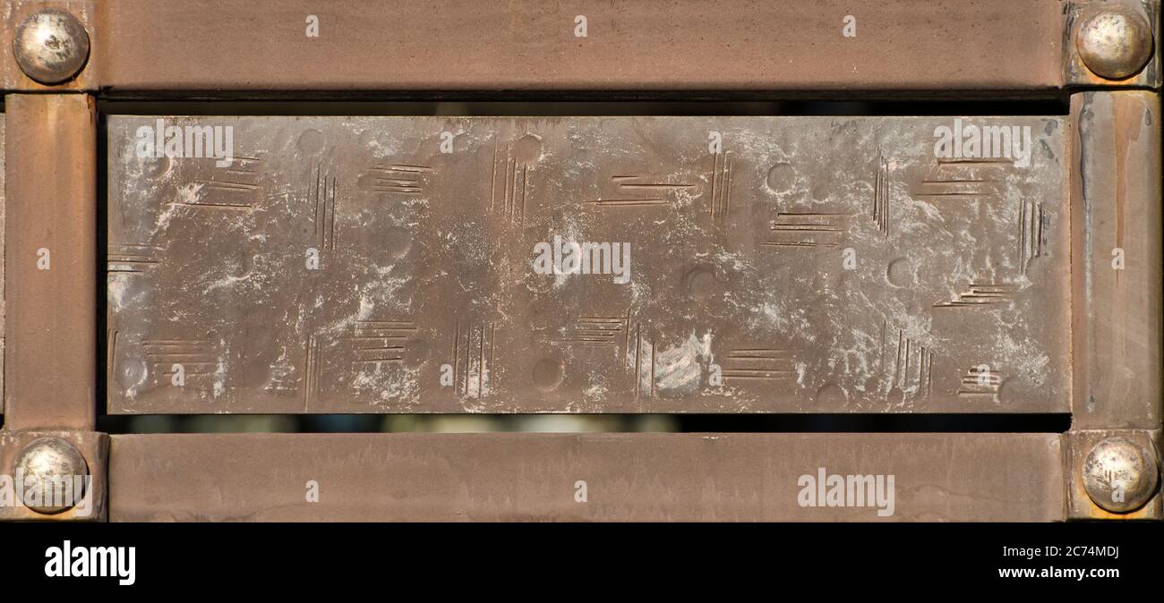 Vintage rectangular plate in metal frame with rivets Stock Photo - Alamy
