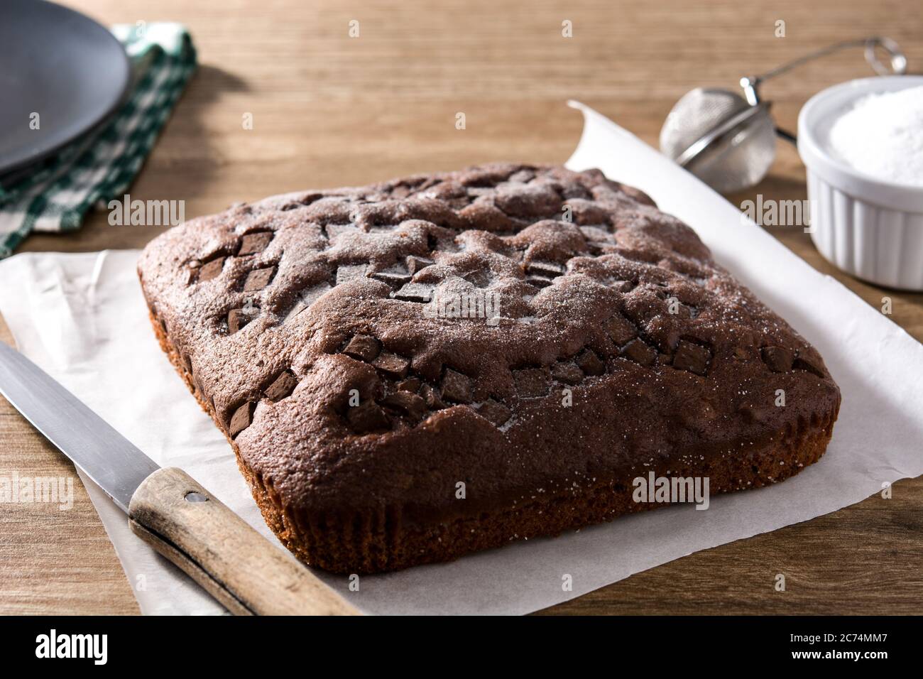 Sweet chocolate sponge cake on wooden table Stock Photo