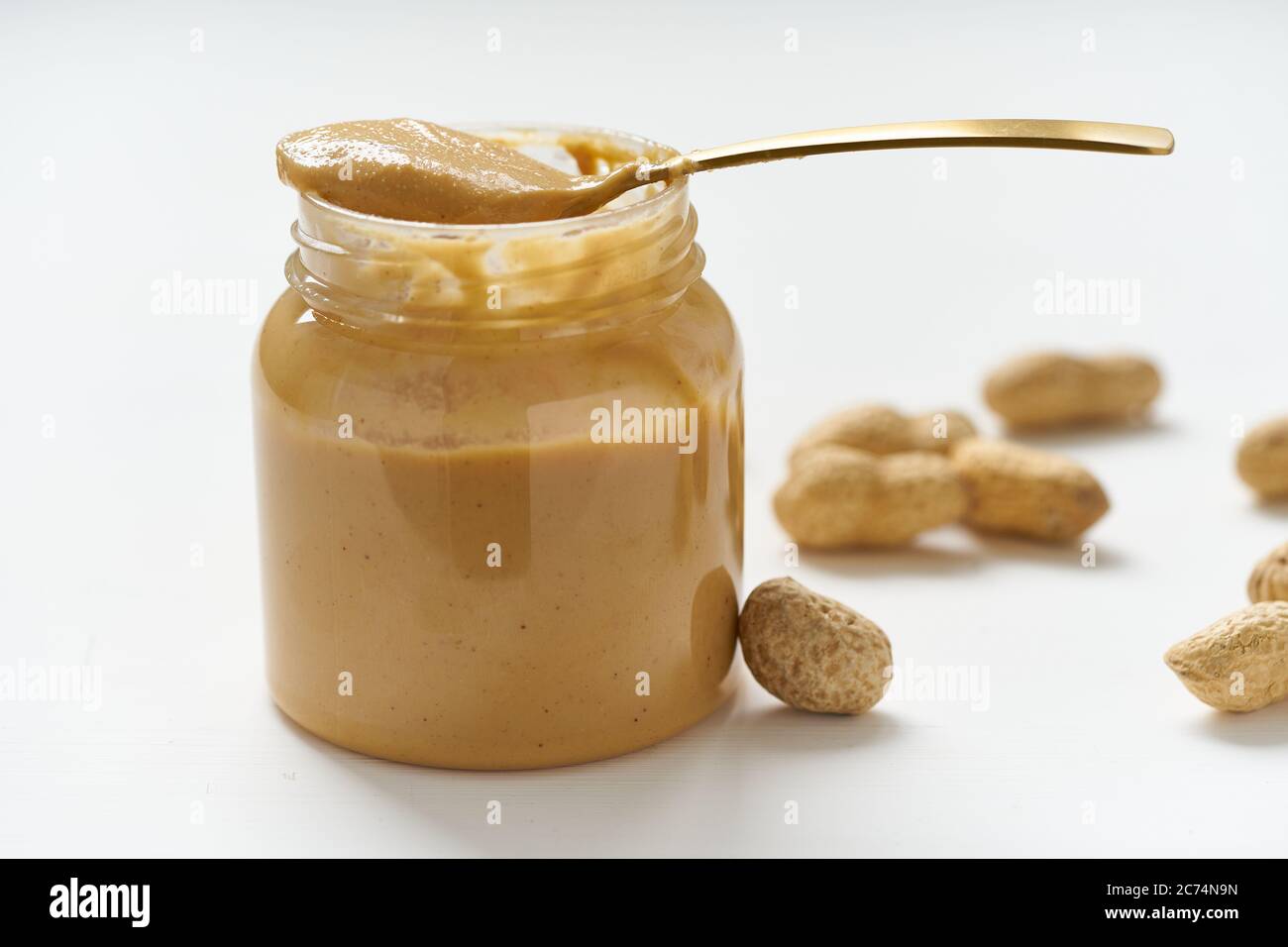 An Open Jar Of Peanut Butter With Spoon Stock Photo, Picture and Royalty  Free Image. Image 13094043.