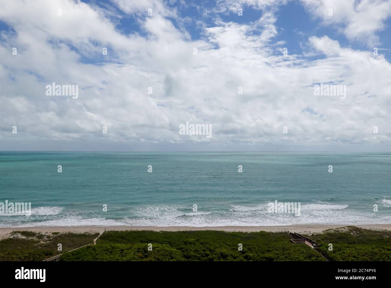An aerial view of the turquoise blue water of the Atlantic Ocean on a ...