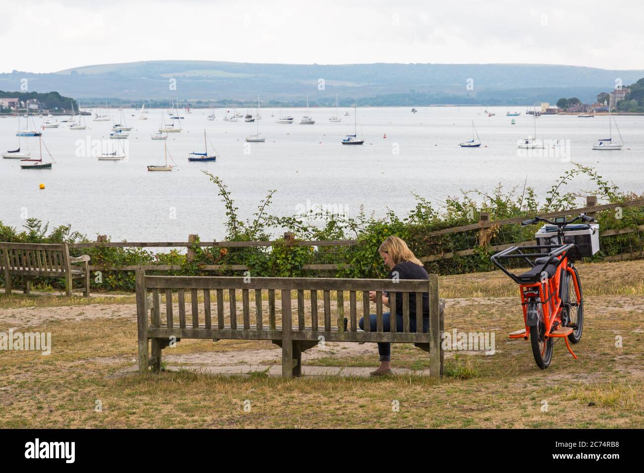 Sandbanks, Poole, Dorset UK. 14th July 2020. Evening Hill in Sandbanks is a popular spot for