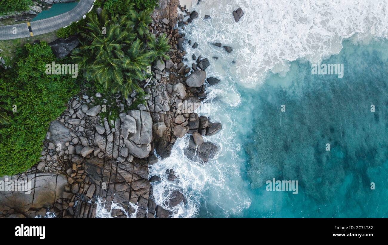 Seychelles beach Indian ocean from drone, shore and mountains.  Stock Photo