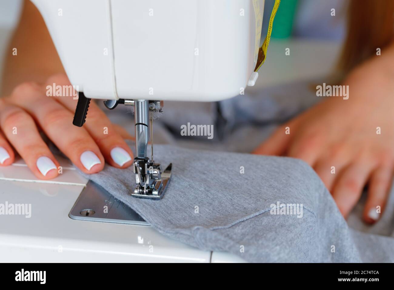 Process of stitching on sewing machine close up view Stock Photo Alamy