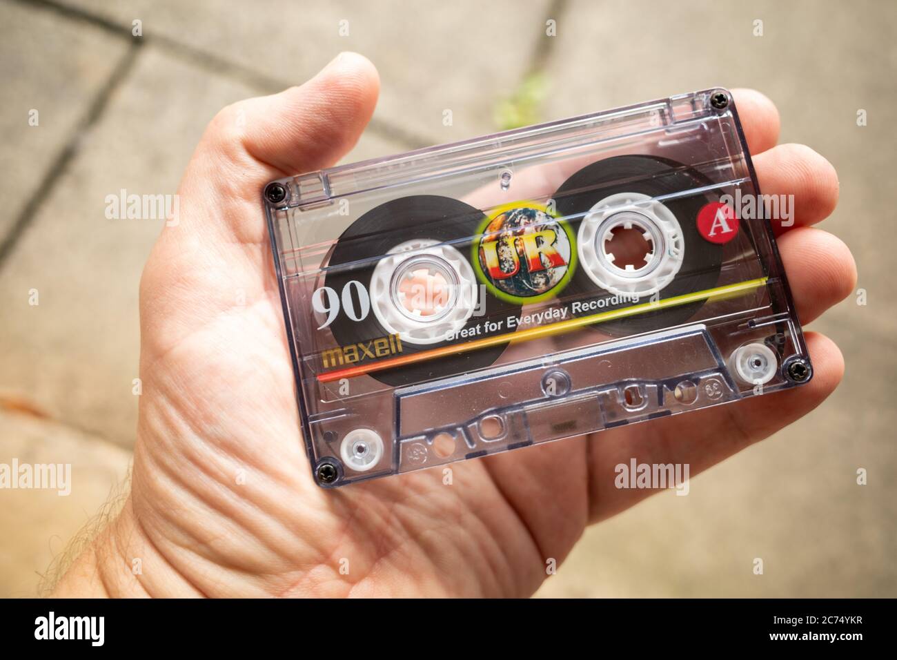 Retro cassette tape Maxell 90 min in a persons hand Side A Stock Photo -  Alamy