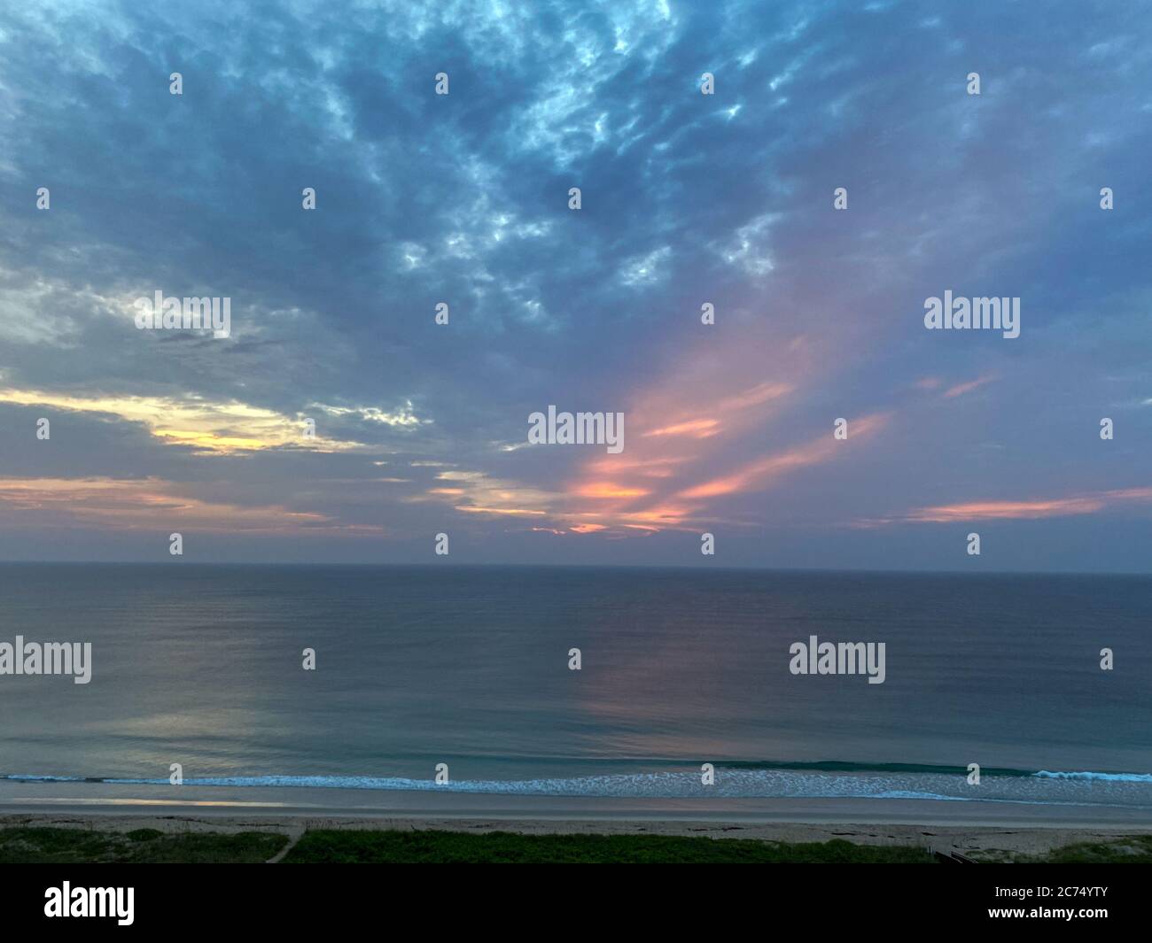 A colorful sunrise over the ocean on a beautiful summer morning Stock ...