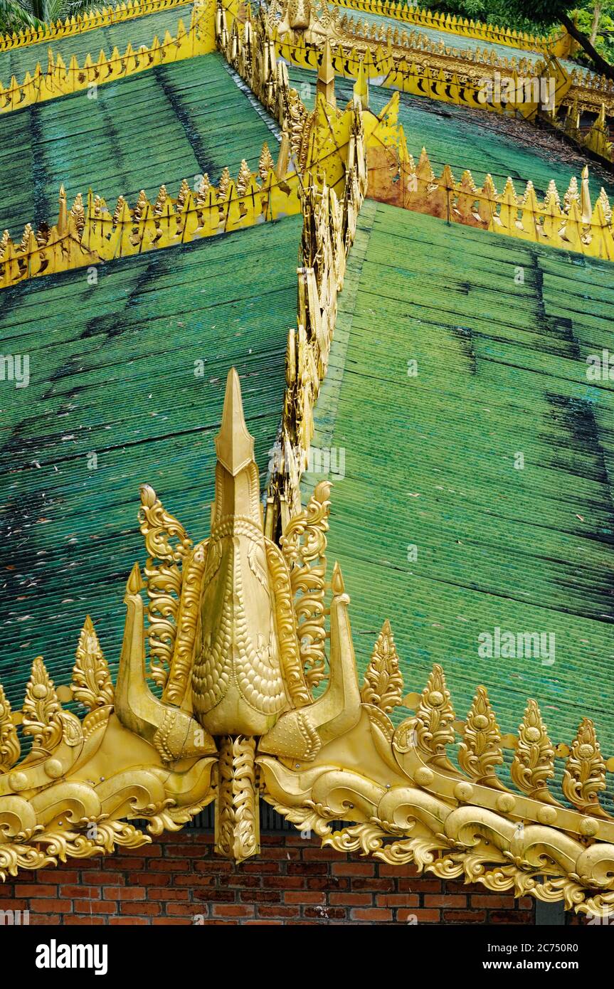 Golden ridge and decoration of a rooftop by the Shwedagon Pagoda, Yangon, Myanmar Stock Photo