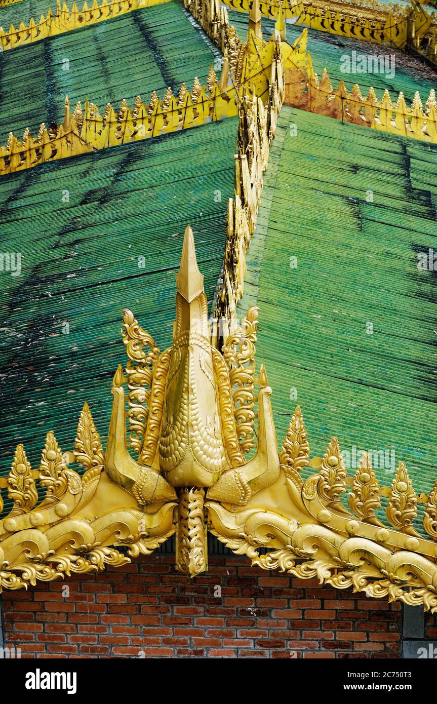 Golden ridge and decoration of a rooftop by the Shwedagon Pagoda, Yangon, Myanmar Stock Photo