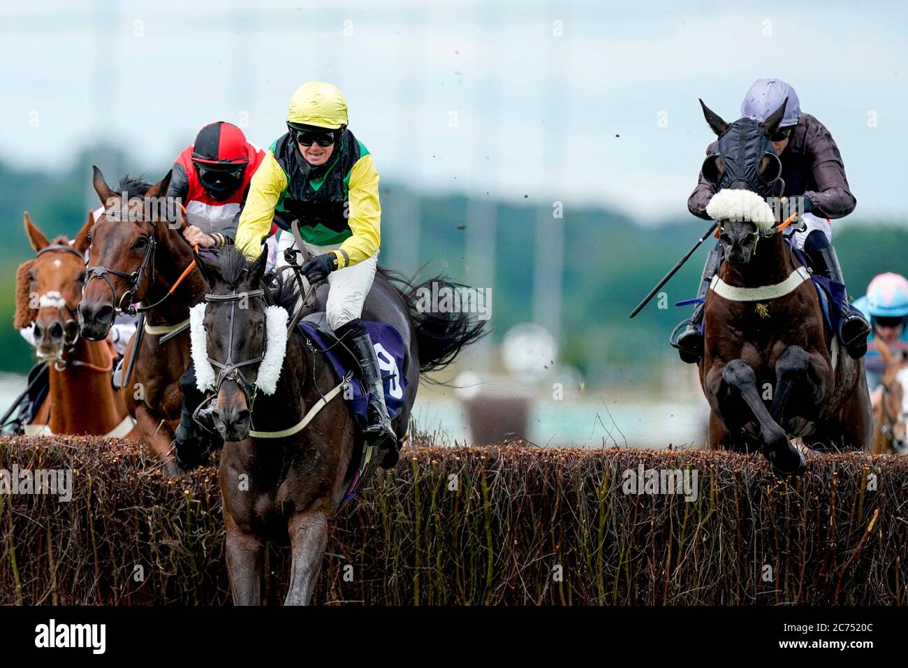 Grand Coureur ridden by jockey Paddy Brennan (right) clears the last to win The Retail Signage At signsolutions.org Handicap Chase at Southwell Racecourse. Stock Photo