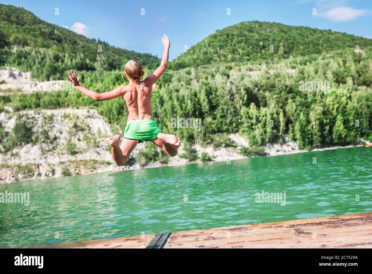 Boy diving into lake hi-res stock photography and images - Alamy