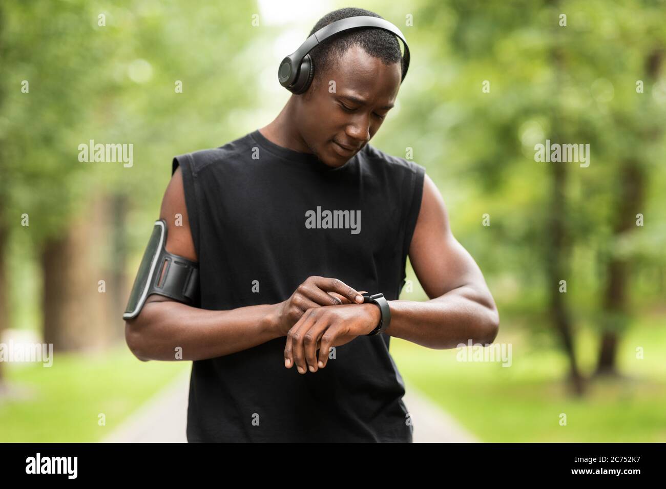 African man working out with fitness bracelet Stock Photo
