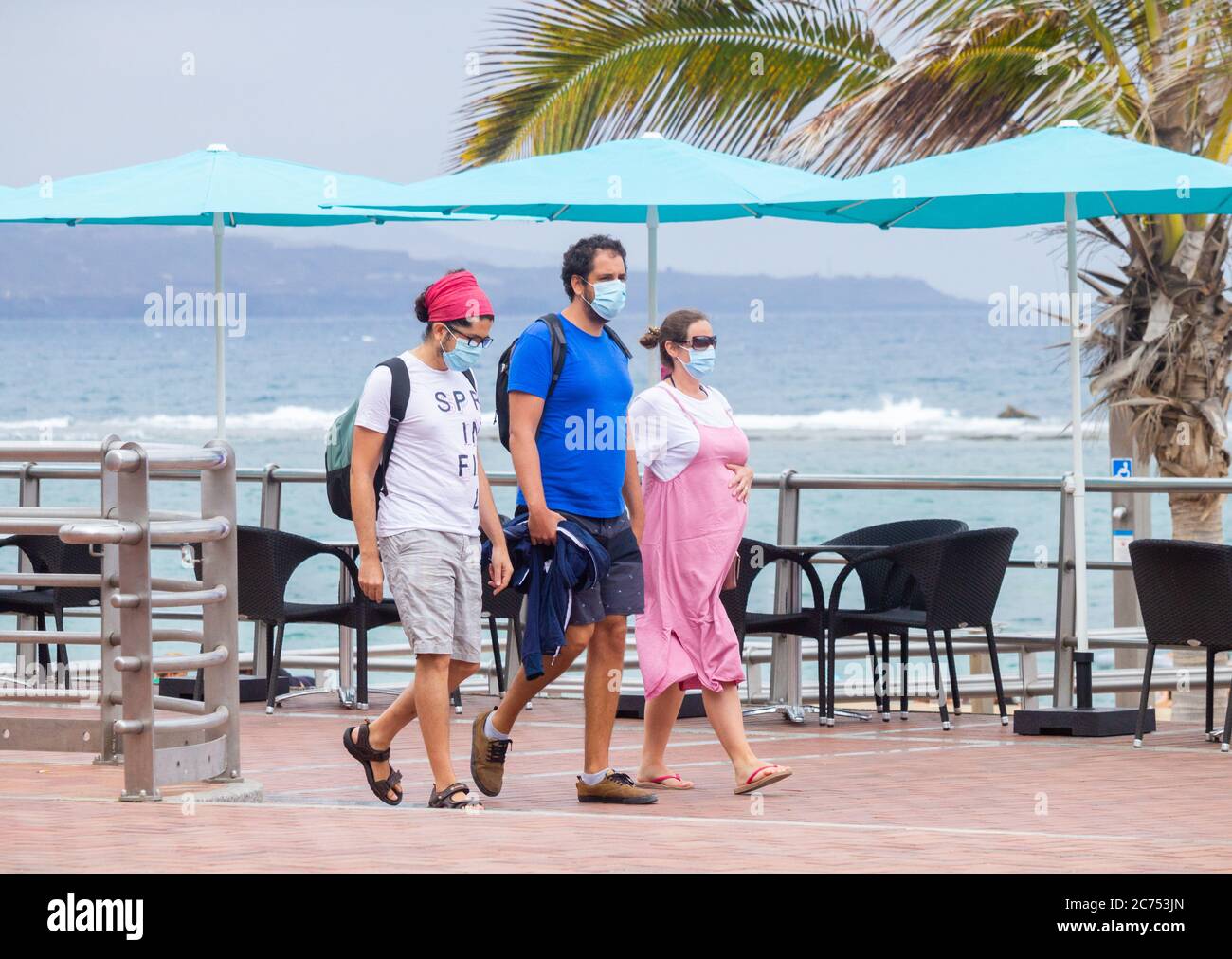 Las Palmas, Gran Canaria, Canary Islands, Spain. 14th July, 2020. People wearing face masks walk