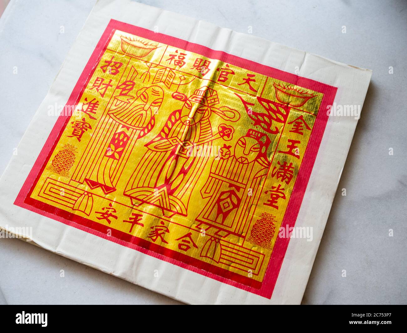 Gold Chinese joss paper aka ghost money, spirit money or hell bank notes which is used for ancestral worship or prayer Stock Photo