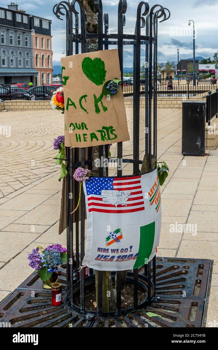 Bantry, West Cork, Ireland. 14th July, 2020. A tribute to the late Jack Charlton, who died on Friday, has appeared in Bantry Square. Created by local, Sean Kelly, whio didn't want to be photographed, the tribute consists of messages on two pieces of cardboard, candles and flowers. Another Jack Charlton fan also placed a flag. Credit: AG News/Alamy Live News Stock Photo