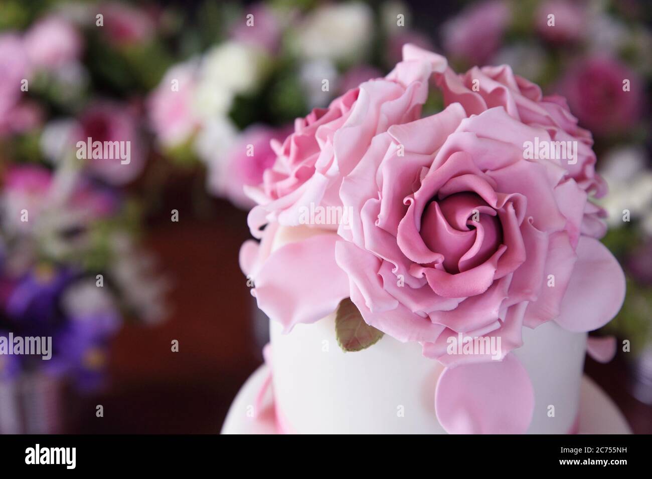 Iced pink sugar flower edible rose flowers Stock Photo Alamy