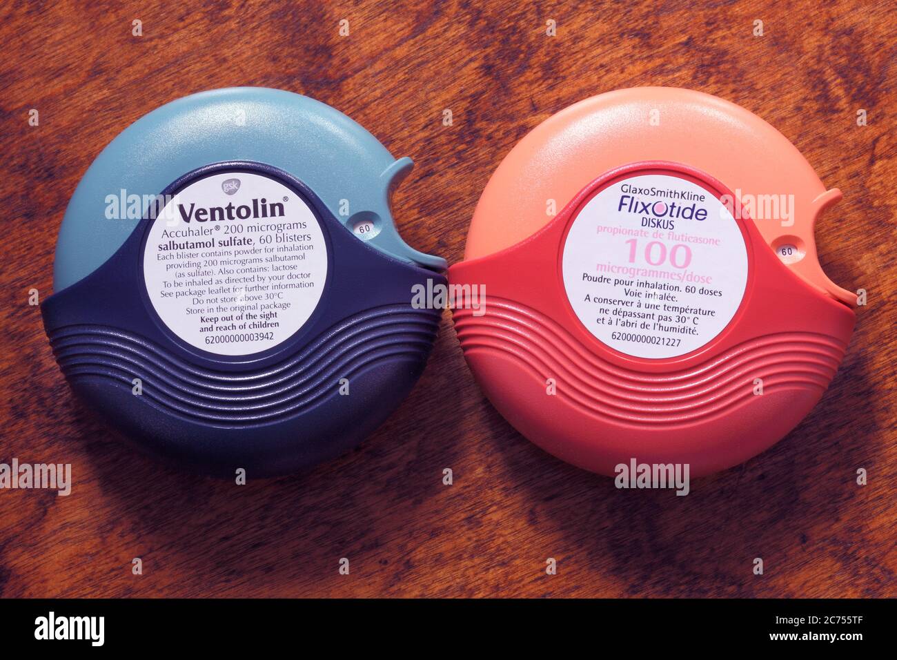 Blue Ventolin asthma reliever and orange Flixotide preventer accuhalers or inhalers Stock Photo