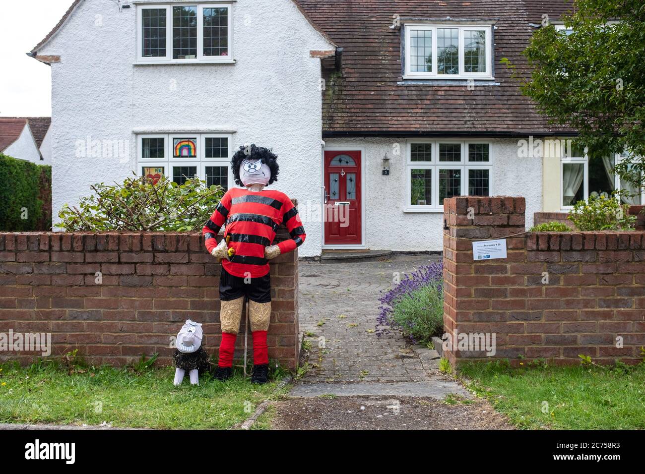 Novelty scarecrow on display outside house during annual scarecrow festival in village of Holwell, near Hitchin, Hertfordshire. Stock Photo