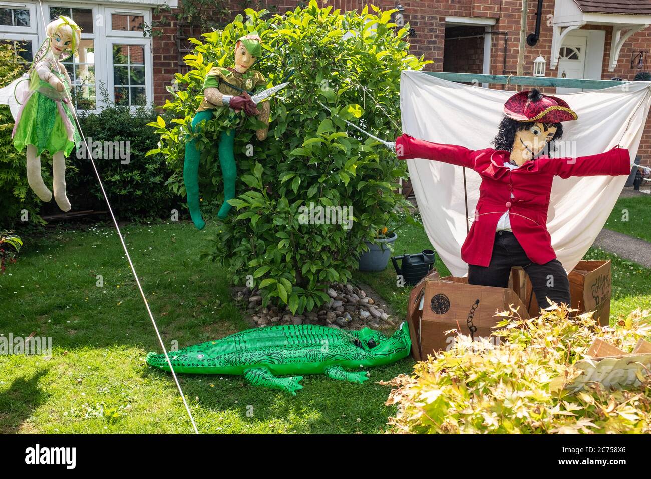 Novelty scarecrow on display outside house during annual scarecrow festival in village of Holwell, near Hitchin, Hertfordshire. Stock Photo