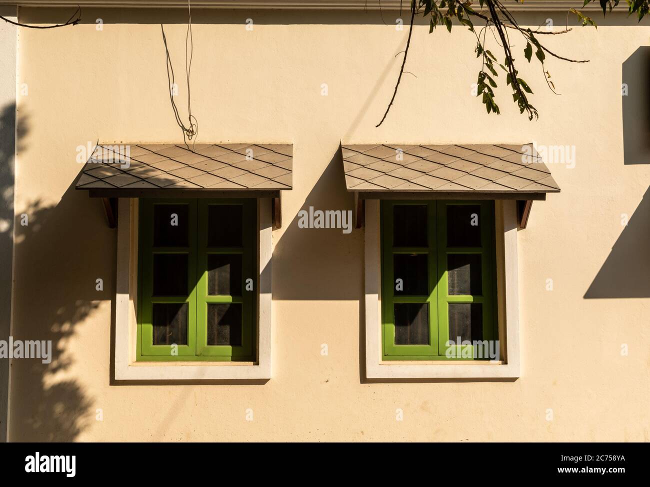Green french style windows of a house in the city of Pondicherry in India. Stock Photo