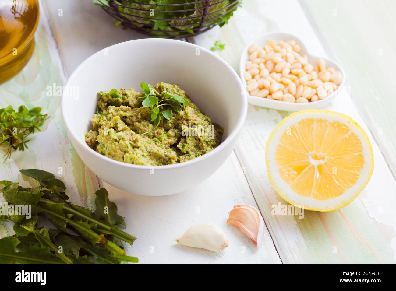 Wild herbs pesto close up in the bowl Stock Photo