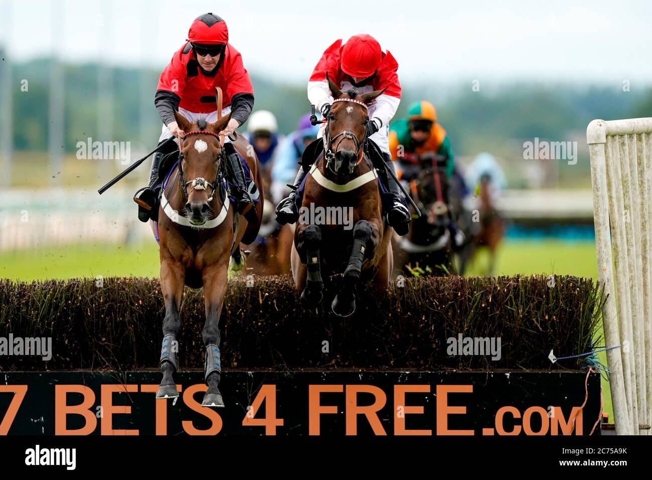 Perfect Grace ridden by jockey Brian Hughes (left) clears the last to win the signsolutions.org For Sponsorship Branding Novices' Hurdle at Southwell Racecourse. Stock Photo