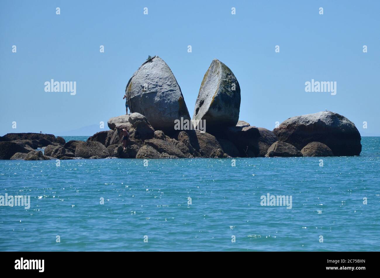 Split Apple Rock is a geological rock formation in Tasman Bay off the northern coast of the South Island of New Zealand. Stock Photo