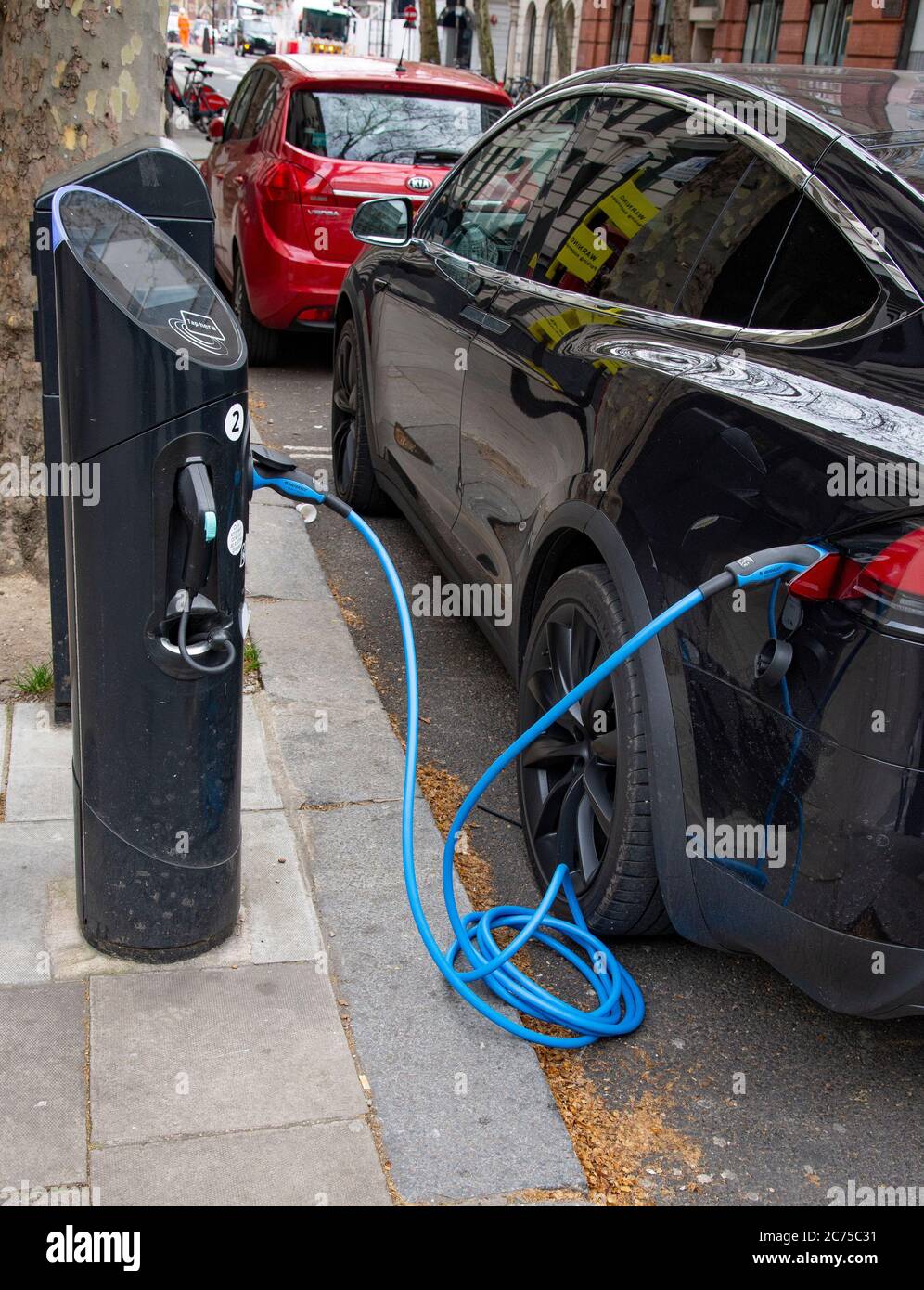 Electric car charging london street hires stock photography and images