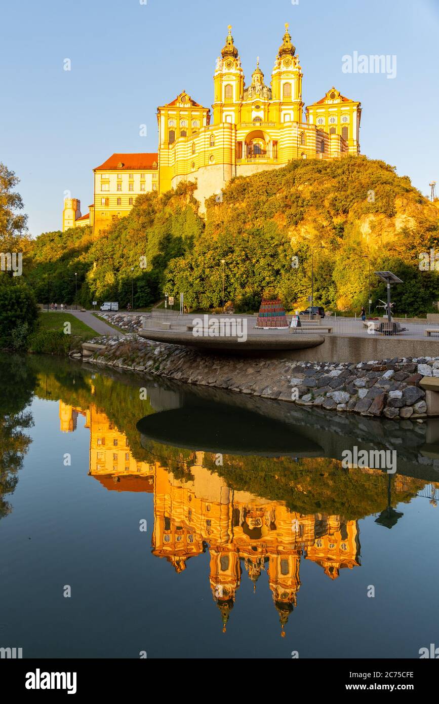 Melk Abbey, German: Stift Melk, reflected in the water of Danube River, Wachau Valley, Austria. Stock Photo
