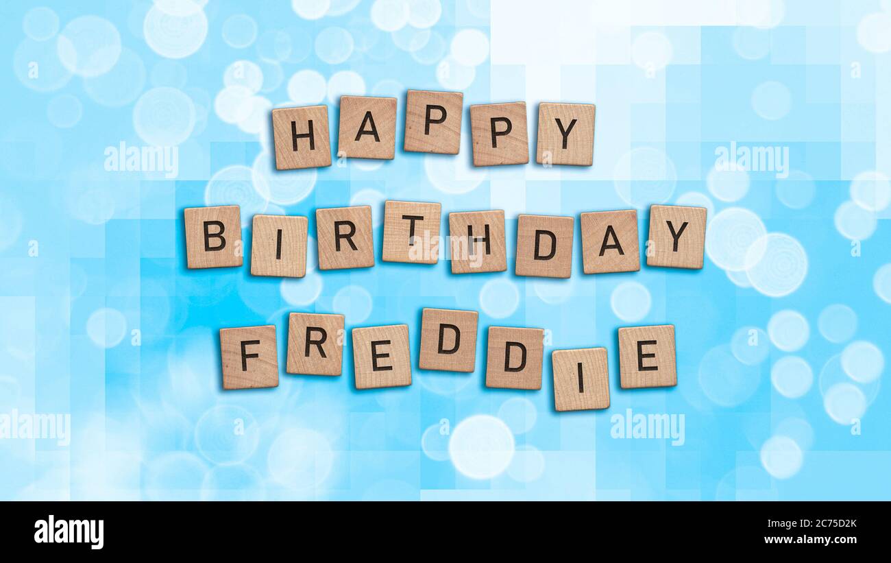 Happy Birthday Freddie card with wooden tiles text. Boys birthday card