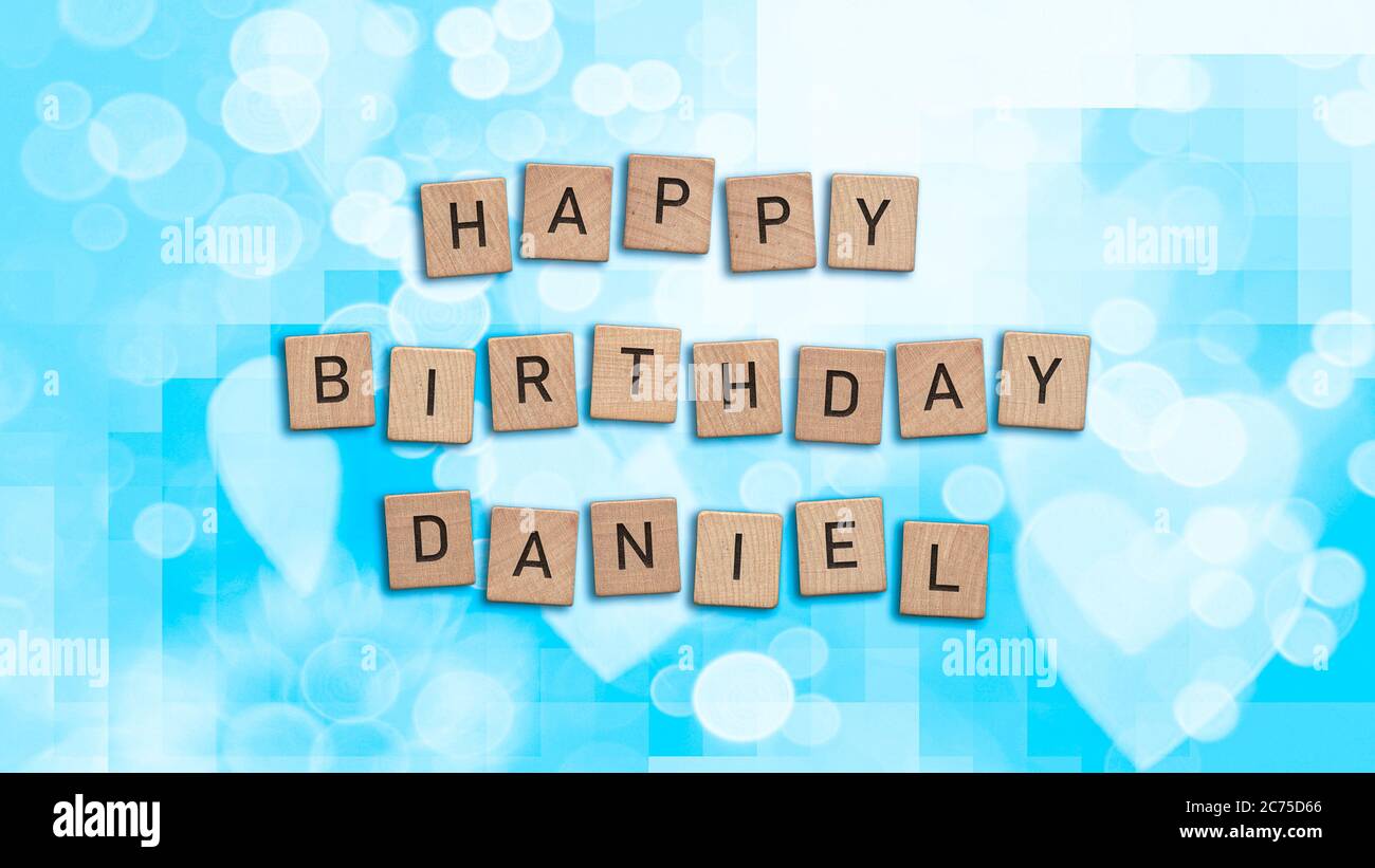 Happy Birthday Daniel card with wooden tiles text. Boys birthday card