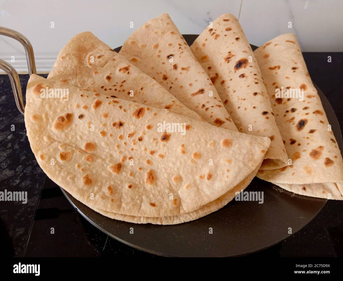 indian bread or roti made from whole wheat flour or refind flour without added yeast Stock Photo