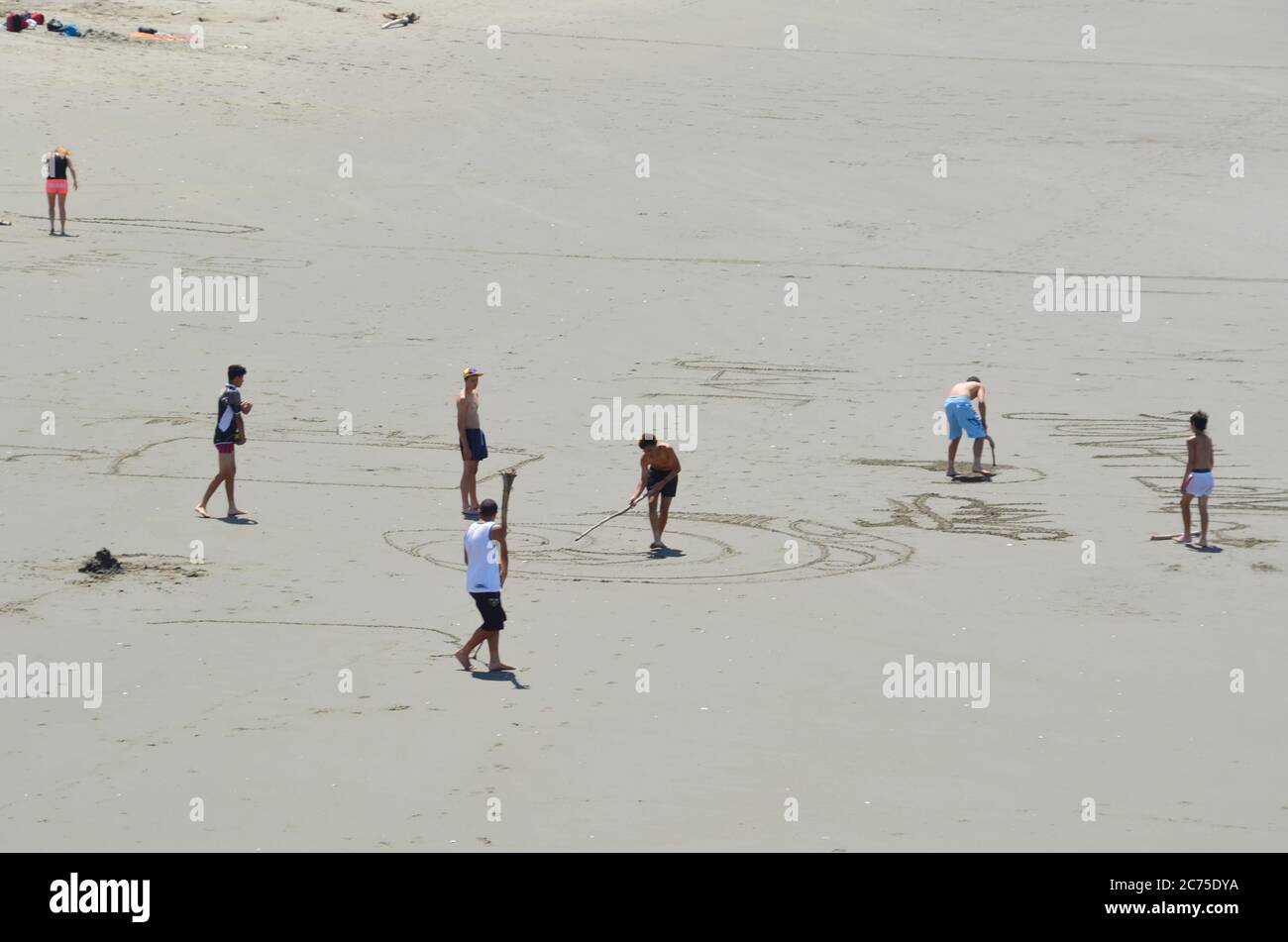 Beautiful New Brighton beach, New Zealand with people playing along the beach during hot afternoon day. Stock Photo