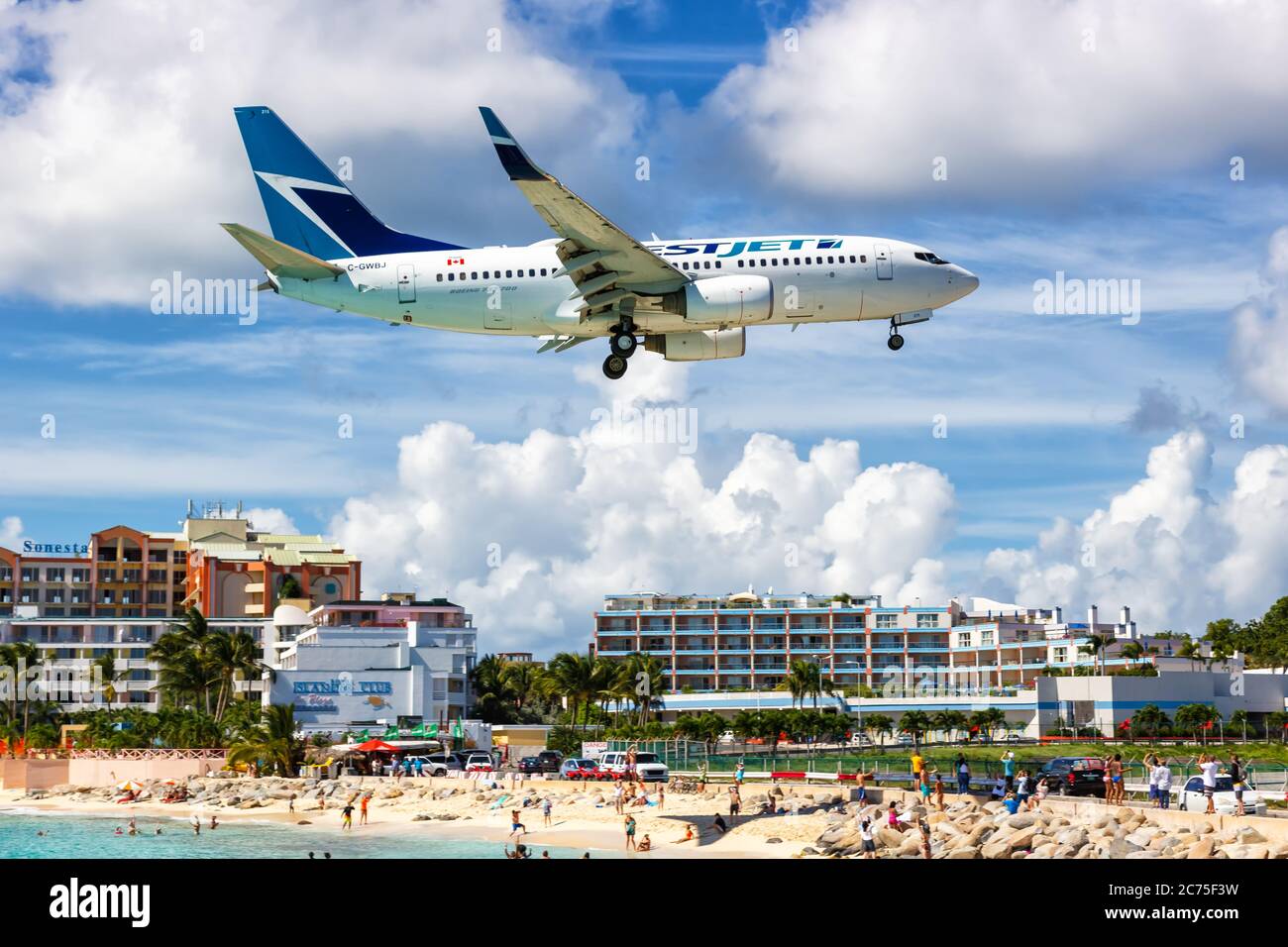 Sint Maarten - September 18, 2016: Westjet Boeing 737-700 airplane at Sint Maarten airport (SXM) in the Caribbean. Boeing is an American aircraft manu Stock Photo